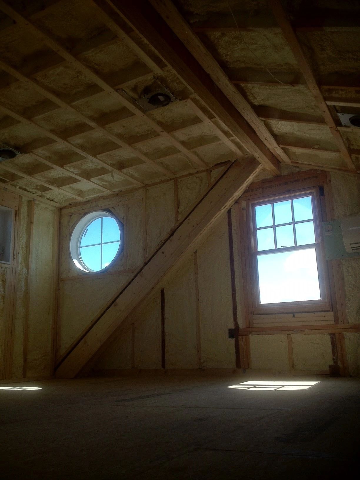 Spray foam insulation applied to wall framing