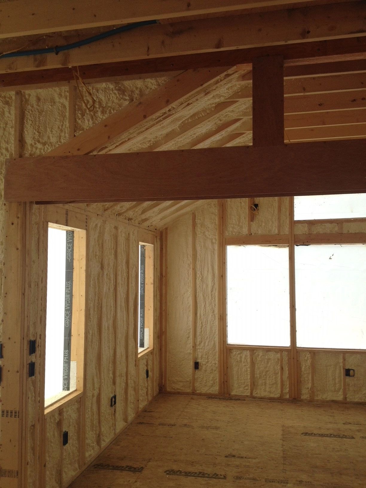 Spray foam on new construction wood framing